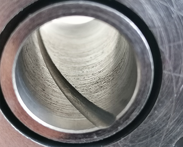 Worn drive-shaft bearing from a rotary compressor.