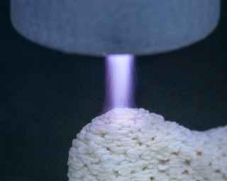 Surface functionalization via a plasma source integrated into additive manufacturing.