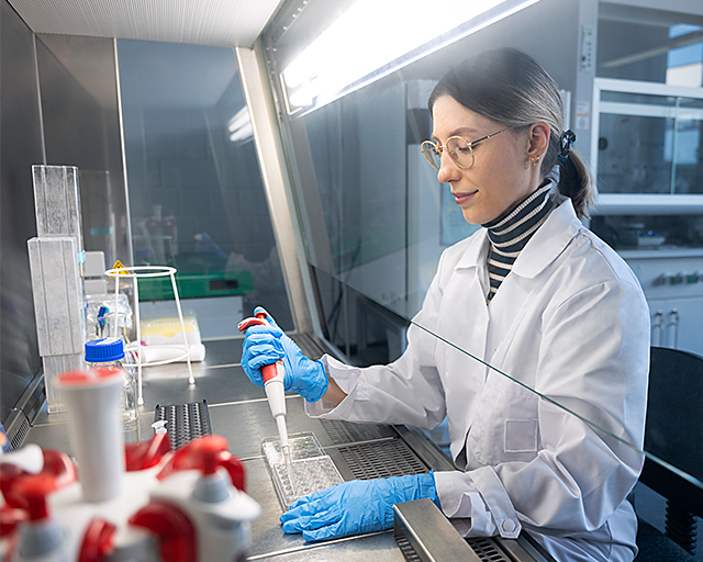 Doctoral student and research associate Johanna Reus at work in the biology lab. 